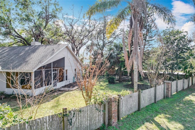 view of yard with a sunroom