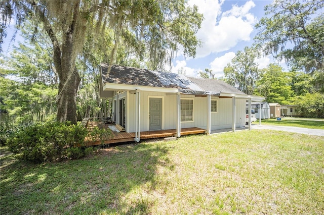 rear view of house with a lawn