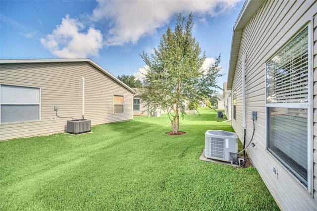 view of yard featuring central air condition unit