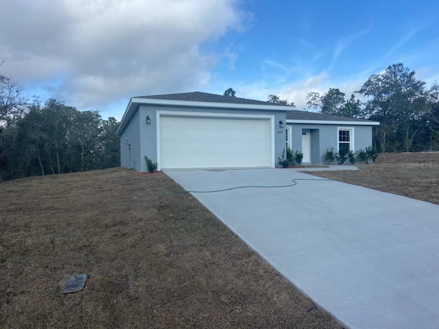 ranch-style house with a garage and a front yard