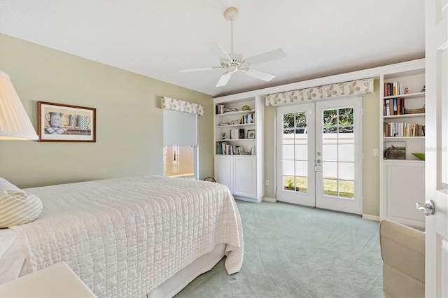 carpeted bedroom with ceiling fan, access to outside, and french doors