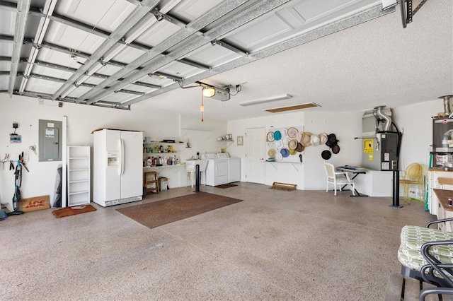 garage with white fridge with ice dispenser, separate washer and dryer, electric panel, and a garage door opener