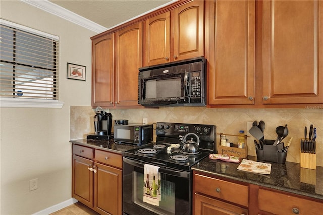 kitchen featuring ornamental molding, dark stone countertops, decorative backsplash, and black appliances