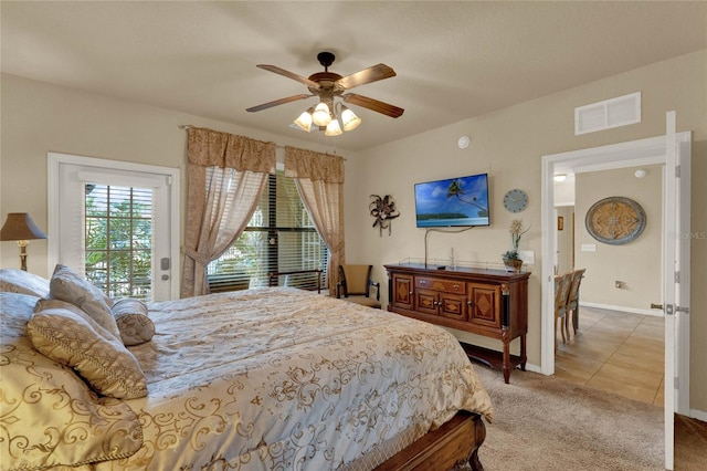 carpeted bedroom with ceiling fan and access to exterior