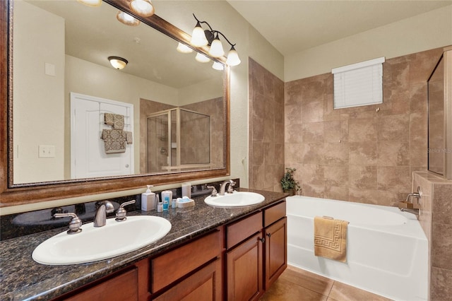 bathroom with tile patterned flooring, vanity, and plus walk in shower