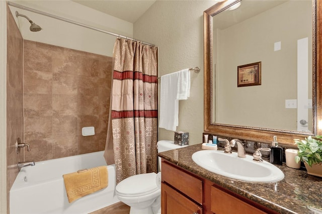 full bathroom featuring shower / bath combination with curtain, vanity, and toilet