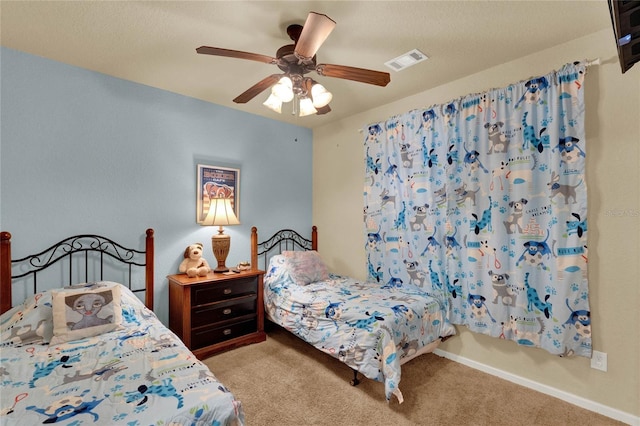 bedroom featuring ceiling fan and light colored carpet