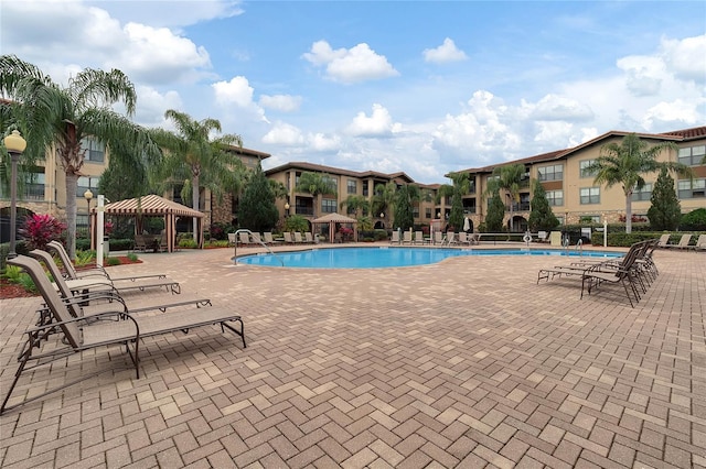 view of swimming pool with a gazebo and a patio