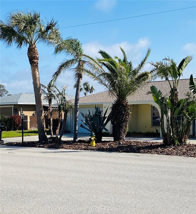 single story home with stucco siding