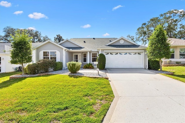 single story home with a garage and a front lawn