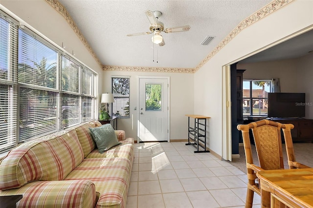 sunroom featuring ceiling fan and vaulted ceiling