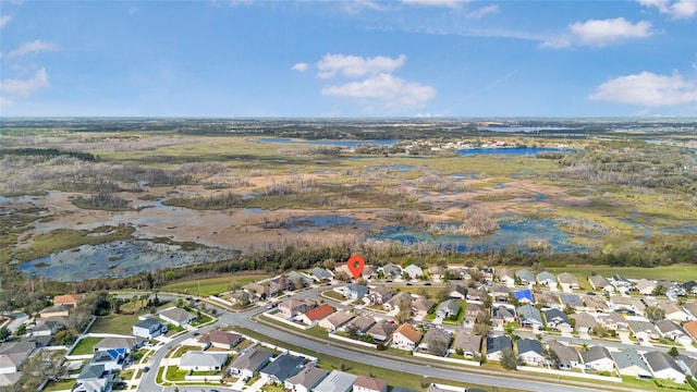 aerial view featuring a residential view and a water view