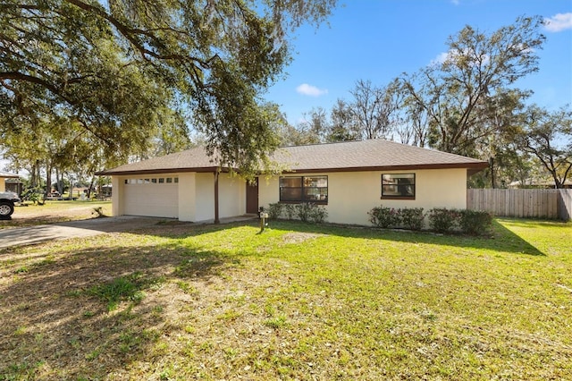 ranch-style home featuring a garage and a front yard