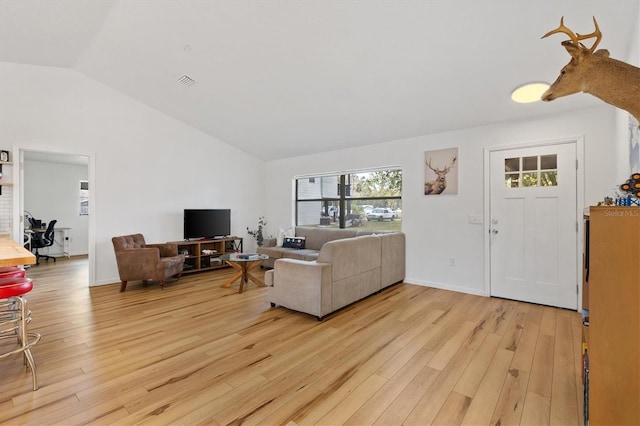 4723 Crk 306, Lake Panasoffkee, FL 33538 - living room with lofted ceiling and light hardwood / wood-style flooring