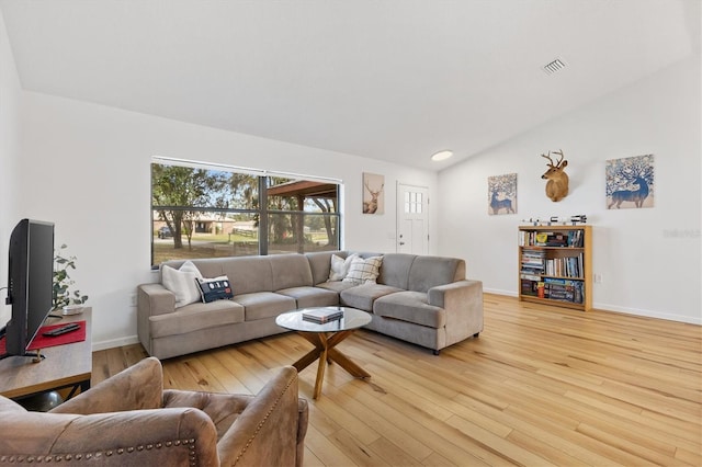 4723 Crk 306, Lake Panasoffkee, FL 33538 - living room with lofted ceiling and light hardwood / wood-style floors