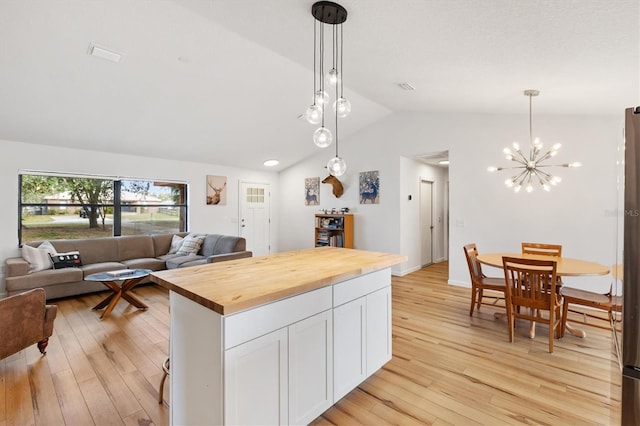 4723 Crk 306, Lake Panasoffkee, FL 33538 - kitchen with white cabinetry, hanging light fixtures, light hardwood / wood-style flooring, and wooden counters