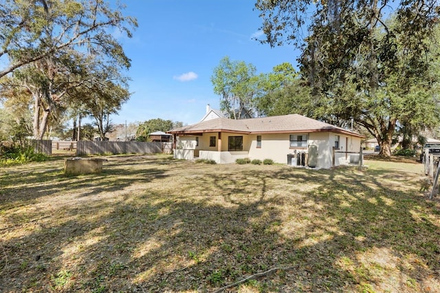 4723 Crk 306, Lake Panasoffkee, FL 33538 - rear view of house with a lawn