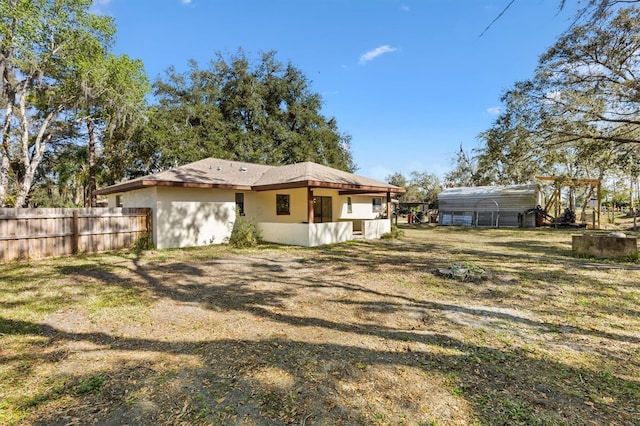 4723 Crk 306, Lake Panasoffkee, FL 33538 - rear view of house featuring a lawn