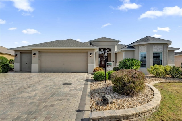 ranch-style home featuring a garage