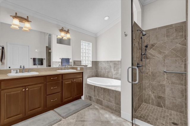 bathroom with crown molding, tile patterned floors, independent shower and bath, and vanity