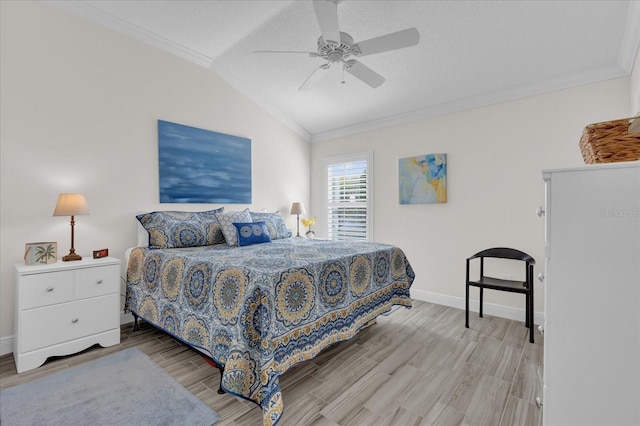 bedroom with hardwood / wood-style flooring, ceiling fan, ornamental molding, and vaulted ceiling