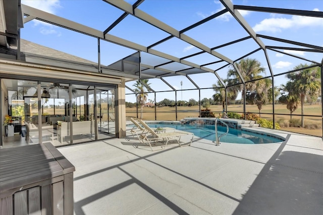 view of pool with a lanai and a patio area