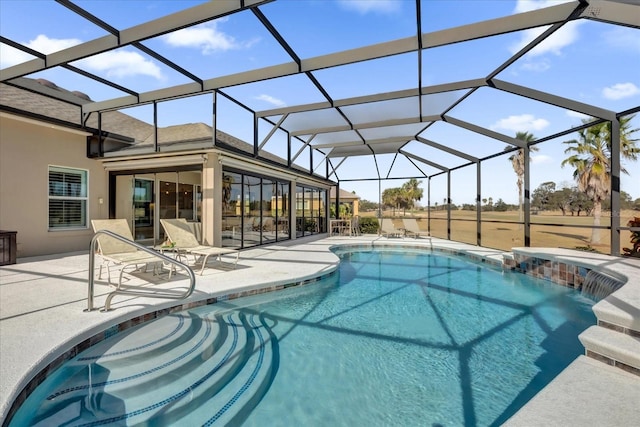 view of swimming pool with a lanai and a patio