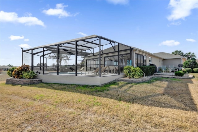 exterior space featuring a pool, a patio area, and a lawn