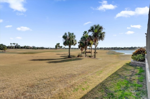 exterior space with a yard and a water view