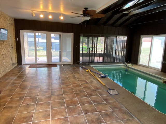 indoor pool featuring ceiling fan