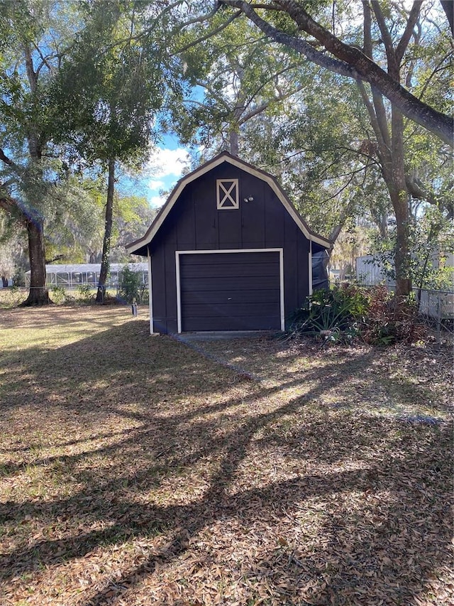 garage featuring fence