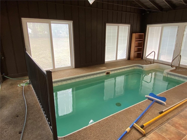 view of swimming pool with a jacuzzi