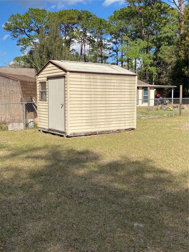 view of shed with a fenced backyard