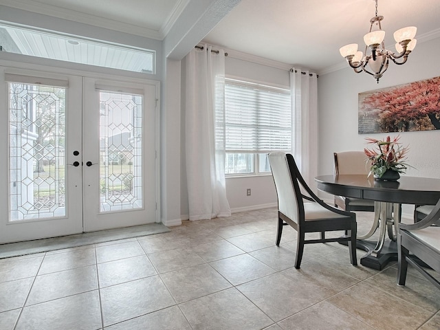 dining area featuring light tile patterned floors, crown molding, french doors, and a chandelier