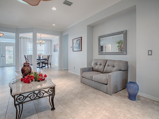 living room featuring a notable chandelier, crown molding, french doors, and light tile patterned floors