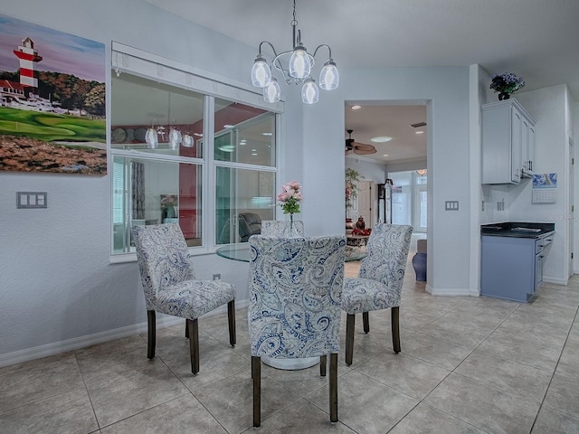 tiled dining room with ceiling fan