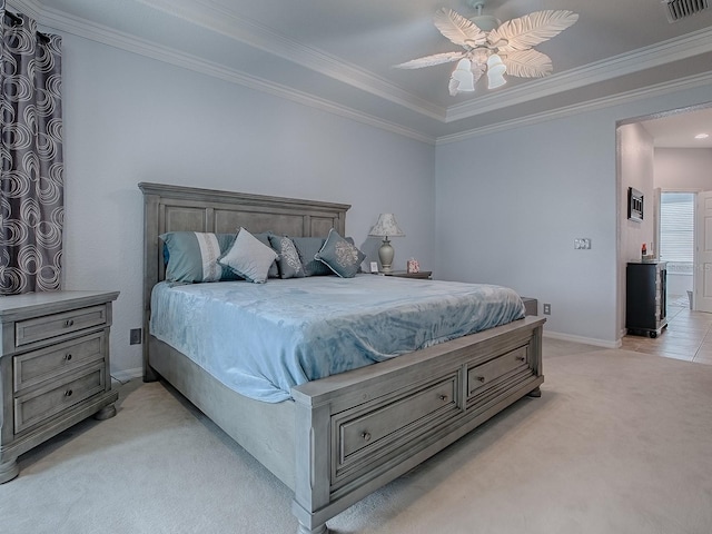 bedroom featuring crown molding, light colored carpet, and ceiling fan