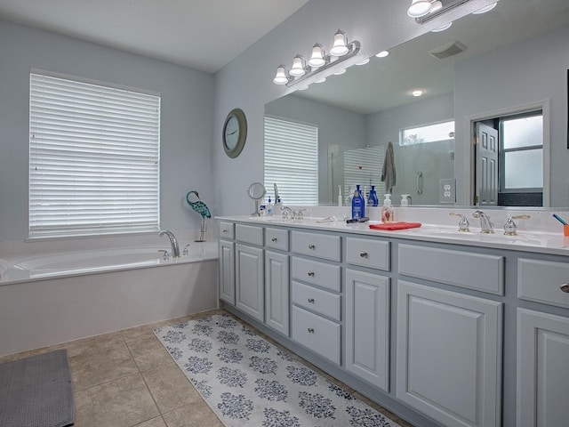 bathroom with vanity, shower with separate bathtub, and tile patterned flooring