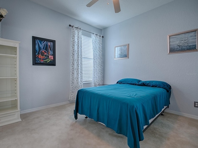 bedroom with carpet floors and ceiling fan