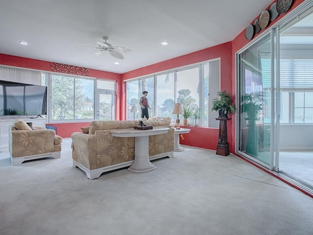 sunroom with ceiling fan and plenty of natural light