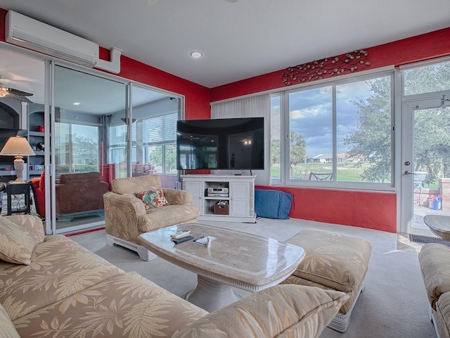 living room with a healthy amount of sunlight and a wall mounted air conditioner