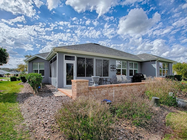 rear view of property with a patio