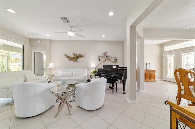 living room with light tile patterned flooring, visible vents, french doors, and recessed lighting