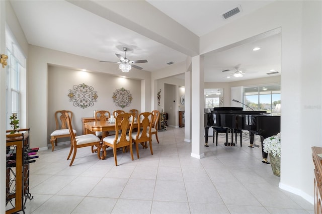 dining area featuring visible vents, ceiling fan, baseboards, and light tile patterned floors