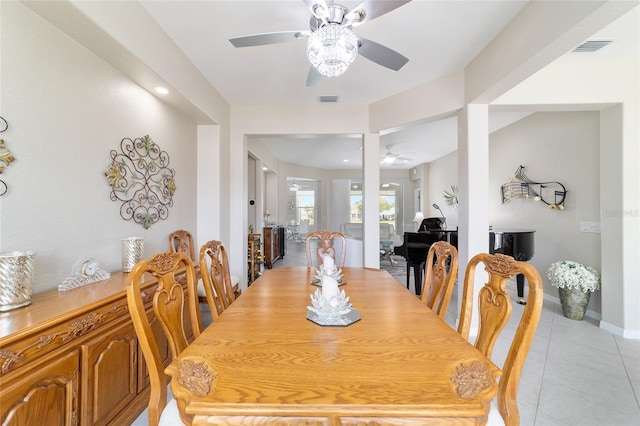 dining area featuring visible vents, ceiling fan, baseboards, and light tile patterned floors