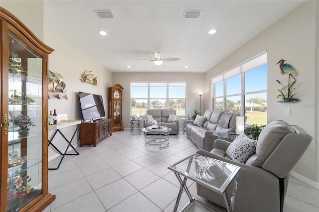 living area featuring ceiling fan, light tile patterned floors, visible vents, and recessed lighting