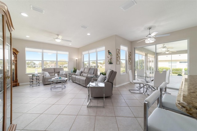 living room with recessed lighting, visible vents, baseboards, and light tile patterned floors