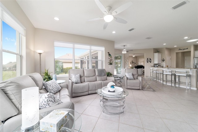 living area with recessed lighting, visible vents, ceiling fan, and light tile patterned flooring