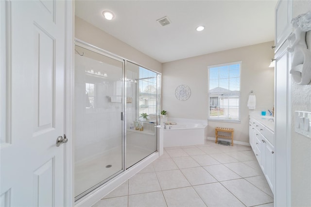 full bath featuring a stall shower, baseboards, tile patterned floors, vanity, and a bath