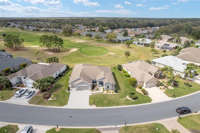 aerial view with a residential view and view of golf course